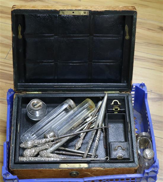 Fifteen assorted silver topped jars, ten assorted silver or white metal mounted button hooks or glove stretchers and a casket,